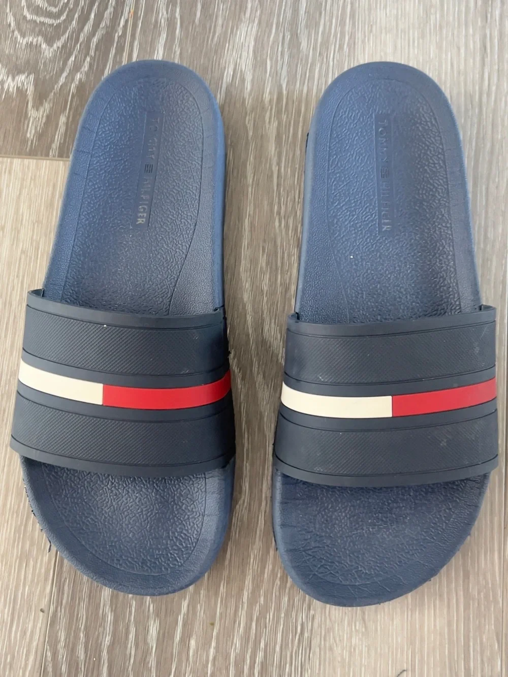Tommy Hilfiger Navy Slides with Red It doesn't have a number but it's like a 10